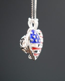 sterling silver american flag heart shaped locket that holds one pearl