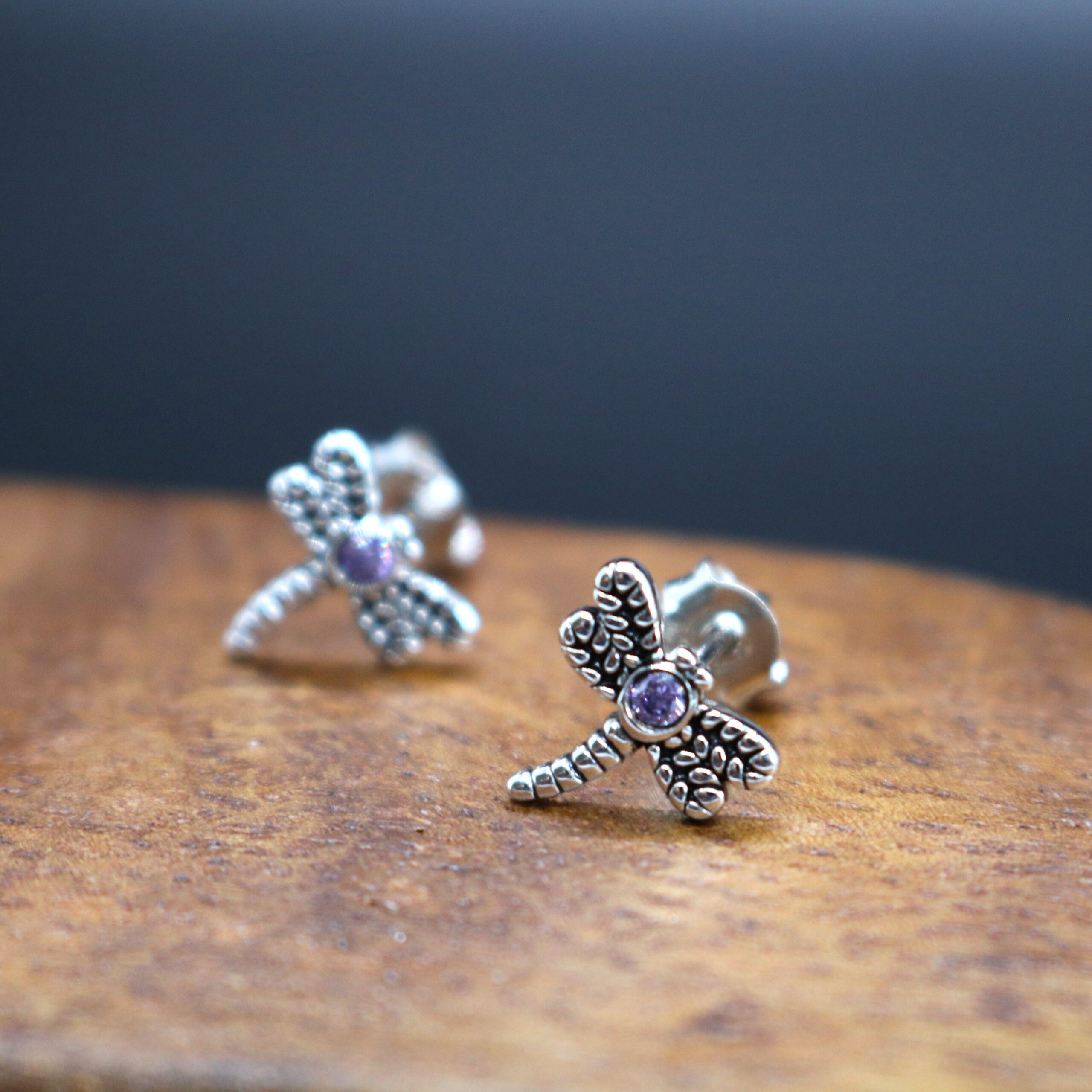 sterling silver dragonfly post earrings with a center lab created amethyst purple stone